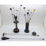 Hat pins including silver, amber and agate and two hat pin stands