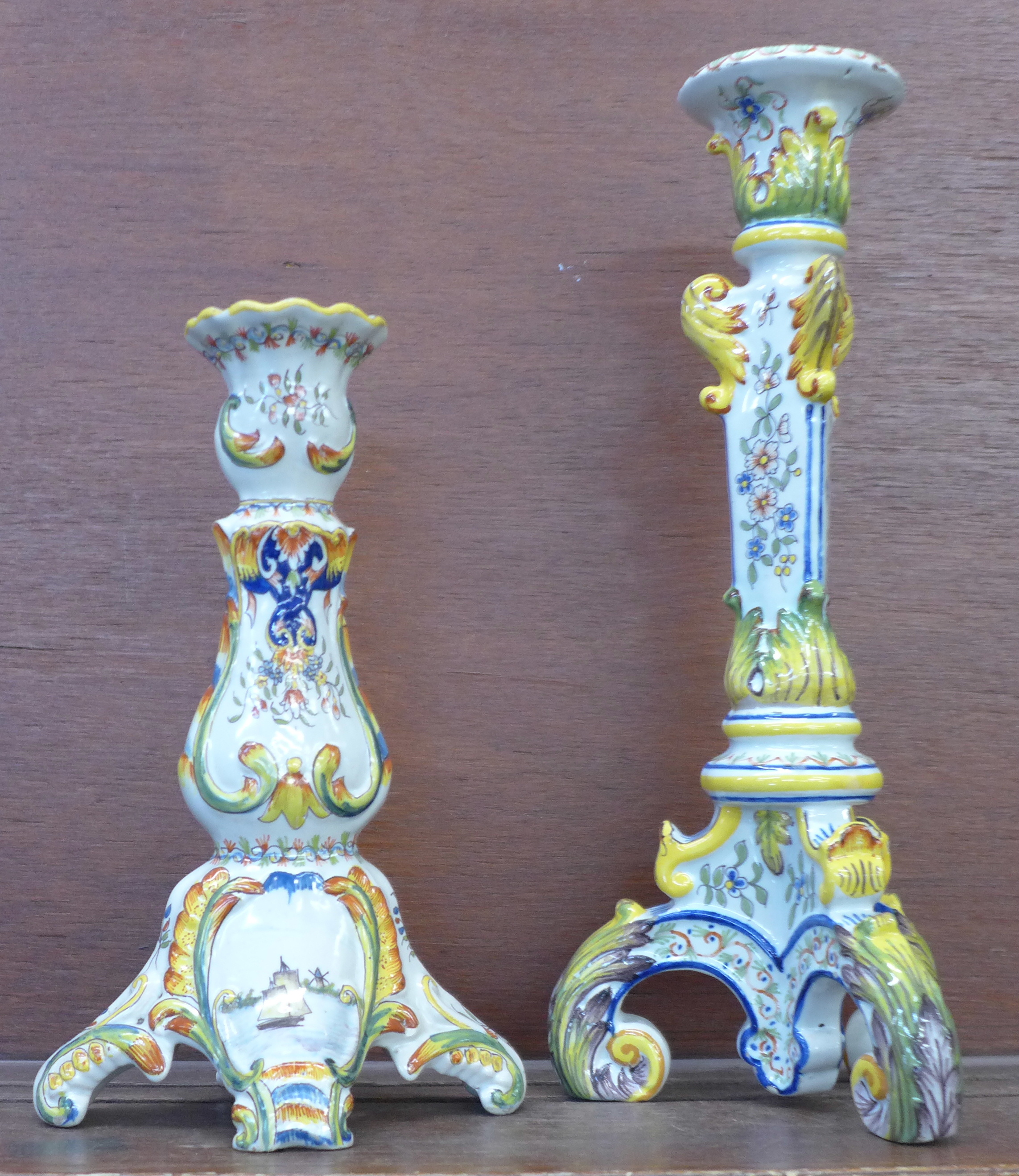 Two majolica candlesticks, tallest 33cm