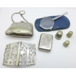 A pair of lorgnettes in a blue case, an Edwardian plated finger purse, a plated nurse's buckle, a