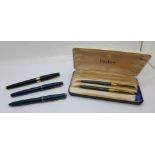 A Parker Slimfold pen with 14ct gold nib, a black Parker 17 pen, a blue Parker 17 Lady pen, a Parker