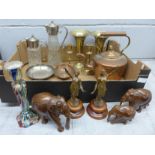A copper kettle, two claret jugs, a pair of metal figures, three carved wooden elephants, a pair