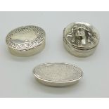 A continental 800 silver pill box, decorated with Art Nouveau style female and two other continental