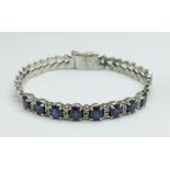 A diamond and sapphire set bracelet, 13.4g, (metal not marked, possible 'marriage')