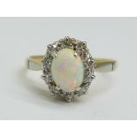 An 18ct gold, platinum set opal and diamond ring, 2.1g, H