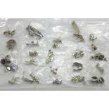 Twenty-five pairs of silver earrings