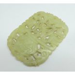 A carved jade plaque, 55mm x 75mm