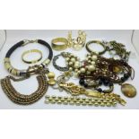 A collection of gold tone fashion jewellery, etc.