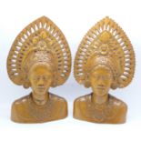 Two carved wooden busts, Djanger dancers, Bali, 24cm, one cracked
