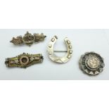 Four Victorian brooches;-three hallmarked silver, one with applied gold decoration, one horseshoe