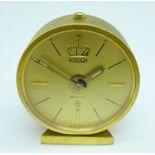 A Jaeger Recital 8-day desk clock in original red leather carry case, diameter 45mm