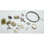 Silver jewellery including four pendants, a bangle, a £1 note charm, a pair of cufflinks, etc.