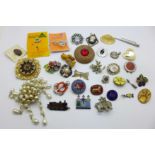 A collection of jewellery and badges