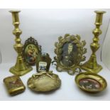 A pair of brass candlesticks, photograph frame, a brass ash tray, an Edwardian pin tray with