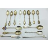 A collection of twelve silver spoons including a set of six golf presentation spoons, a silver