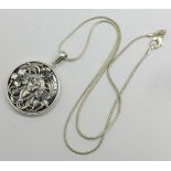 A sterling silver Art Nouveau style pendant and chain, diameter 30mm