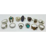 Thirteen rings;-ten silver, (one opal set a/f), and three white metal including tigers eye set