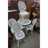 A cast alloy garden table and four chairs