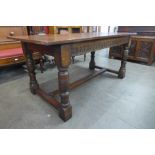 A 17th Century style carved oak refectory table, 76cms h, 169cms l, 81cms w