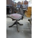 An oak revolving desk chair