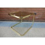 A brass and smoked glass occasional table