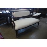 An Edward VII mahogany and upholstered salon settee, 87cms h, 136cms w, 65cms d