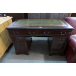 A mahogany and leather topped pedestal desk