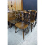 A set of four Ercol dark elm and beech fleur de lys chairs