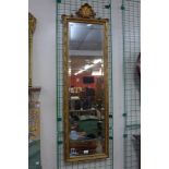 A rococo style gilt framed mirror, 135cms h