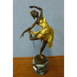 An Art Deco style gilt bronze figure of a ballerina, on green marble socle, 50cms h