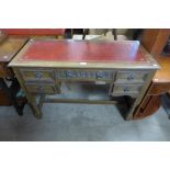 An oak and leather topped desk