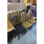 A Harlequin set of six beech wheelback kitchen chairs