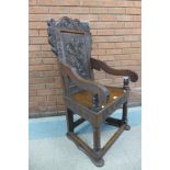 A 17th Century style carved oak Wainscott chair, 116cms h, 61cms w, 52cms d