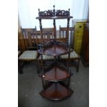 A Victorian style mahogany four tier corner whatnot
