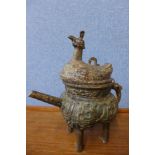 An oriental bronze tea pot and cover, 28cms h