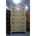 A George III style bleached walnut chest on chest