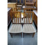 A set of four William Lawrence teak dining chairs