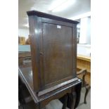 A small Victorian oak splay front hanging corner cupboard