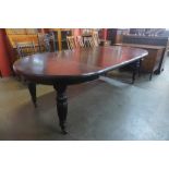 A Victorian oak extending dining table, 75cms h, 123cms l (242cms l extended), 121cms w