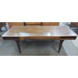 A Danish CFC Silkeborg rosewood coffee table, designed by Johannes Andersen, 51cms h, 151cms w,