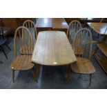 An Ercol Blonde elm and beech Windsor drop-leaf table and four Quaker chairs