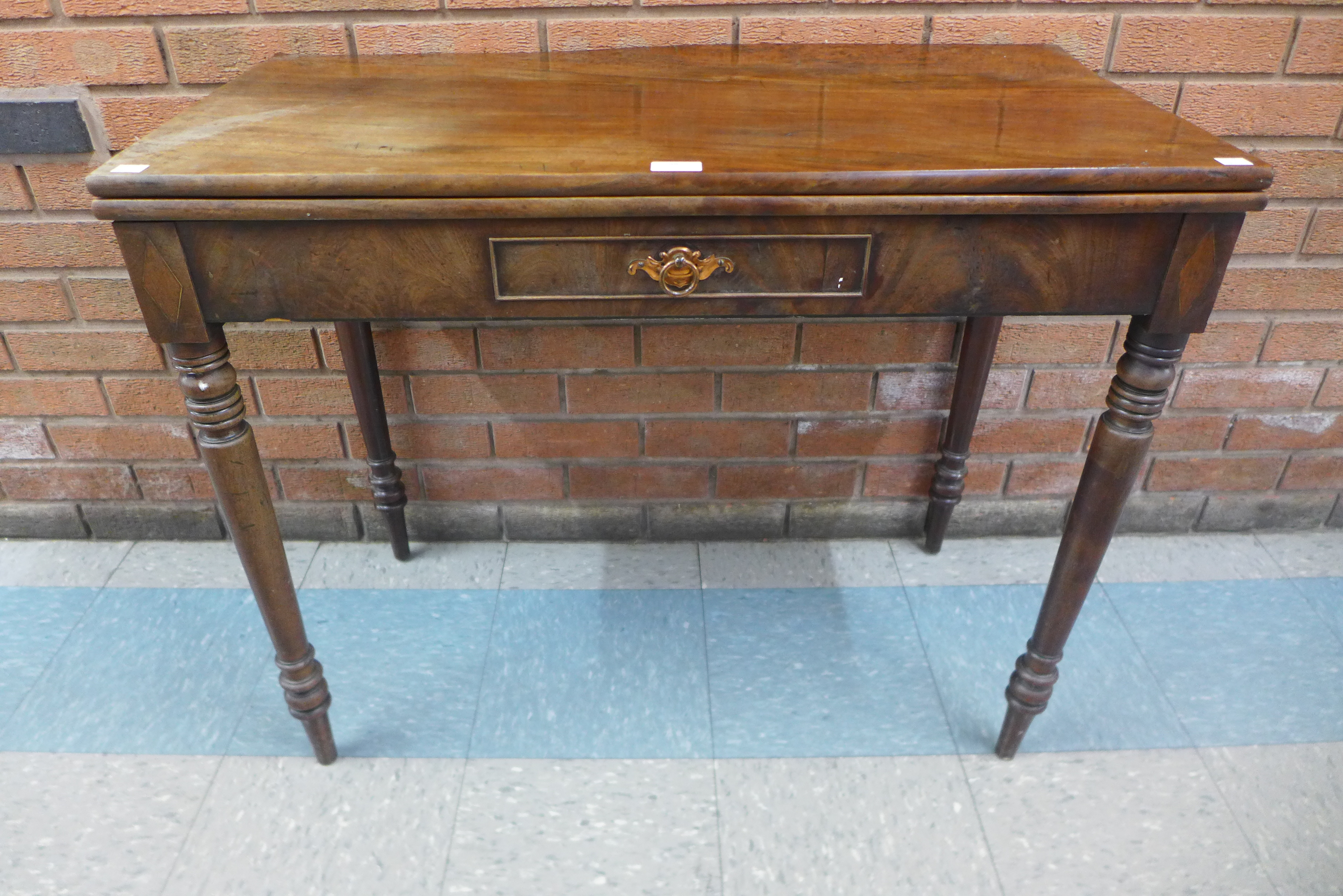 A George IV mahogany rectangular fold over tea table