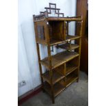 A Japanned bamboo side cabinet, 185cms h, 88cms w, 40cms d