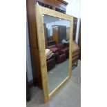 A large pine framed mirror