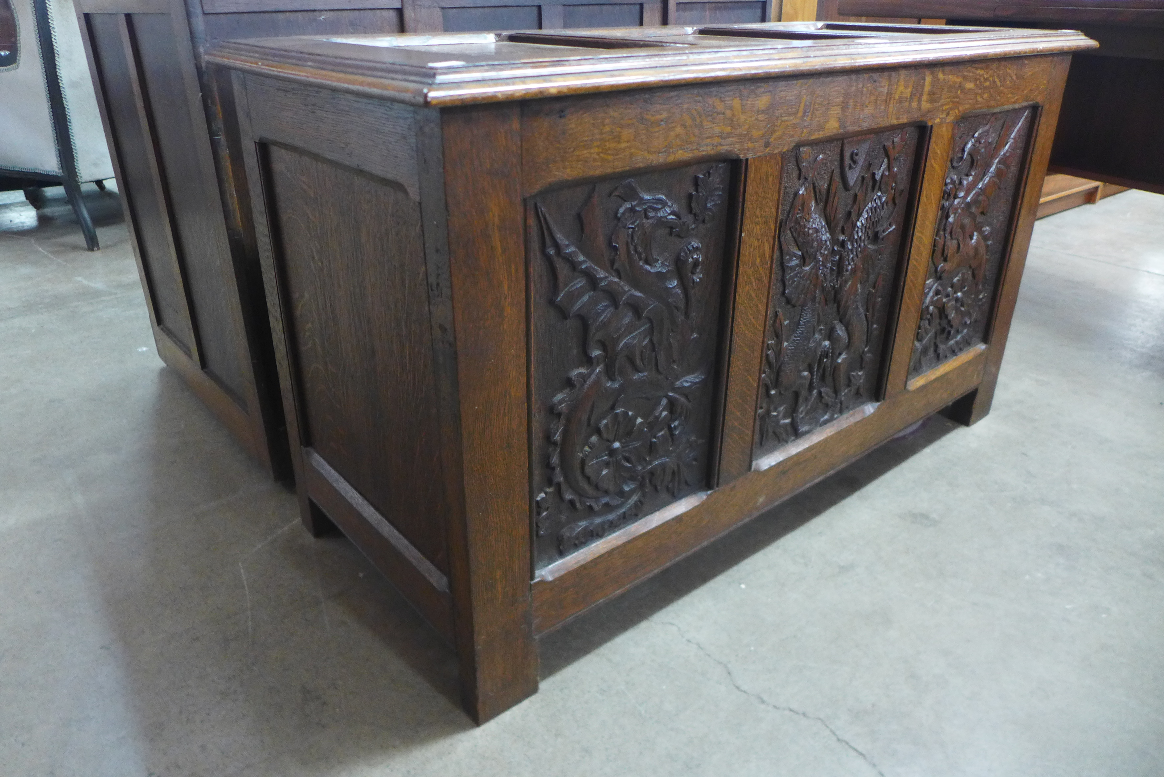 A 17th Century style carved oak coffer, 65cms h, 116cms w, 49cms d - Image 2 of 3