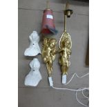 A pair of gilt cherub wall lights, a pair of cast iron bath feet and an aluminium rack