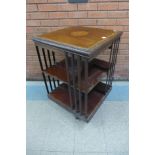 An Edward VII inlaid mahogany revolving bookcase, 89cms h