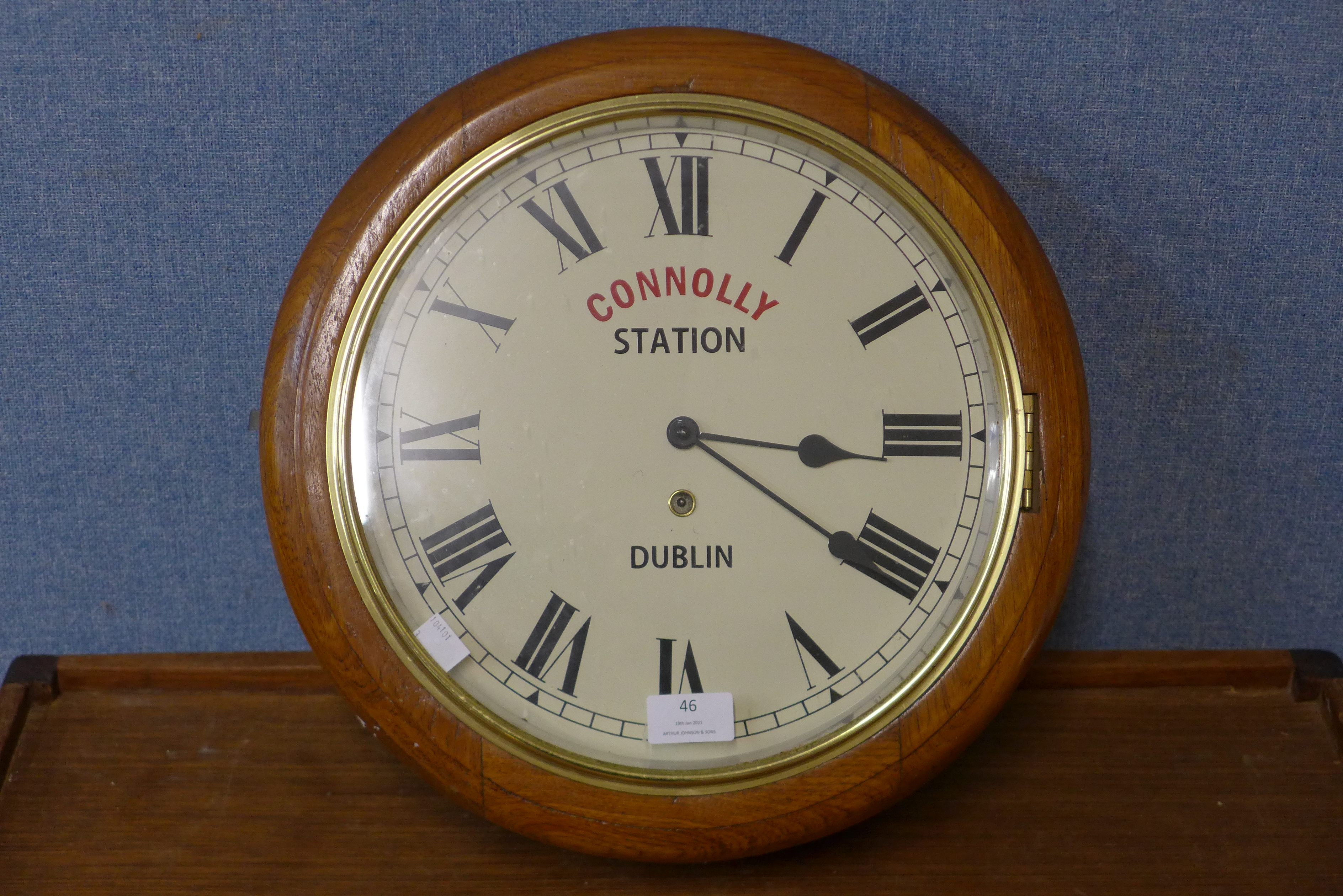 An oak circular wall clock, bearing Connolly Station, Dublin inscription to dial, 39cms d