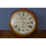 An oak circular wall clock, bearing Connolly Station, Dublin inscription to dial, 39cms d