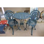 A painted cast alloy garden table and two chairs