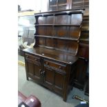 An Ercol dark elm dresser